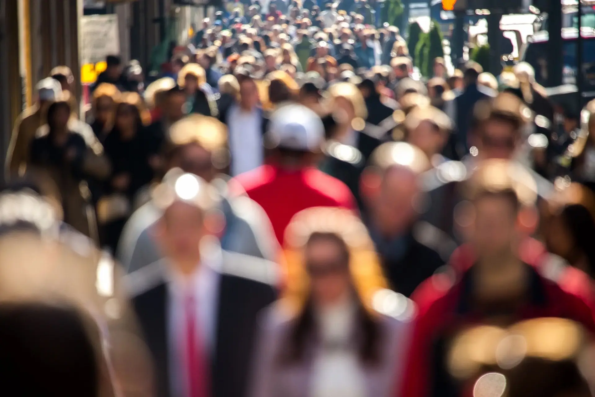 A crowd of workers walking through city streets, symbolizing collective awareness and movement toward digital autonomy and data protection